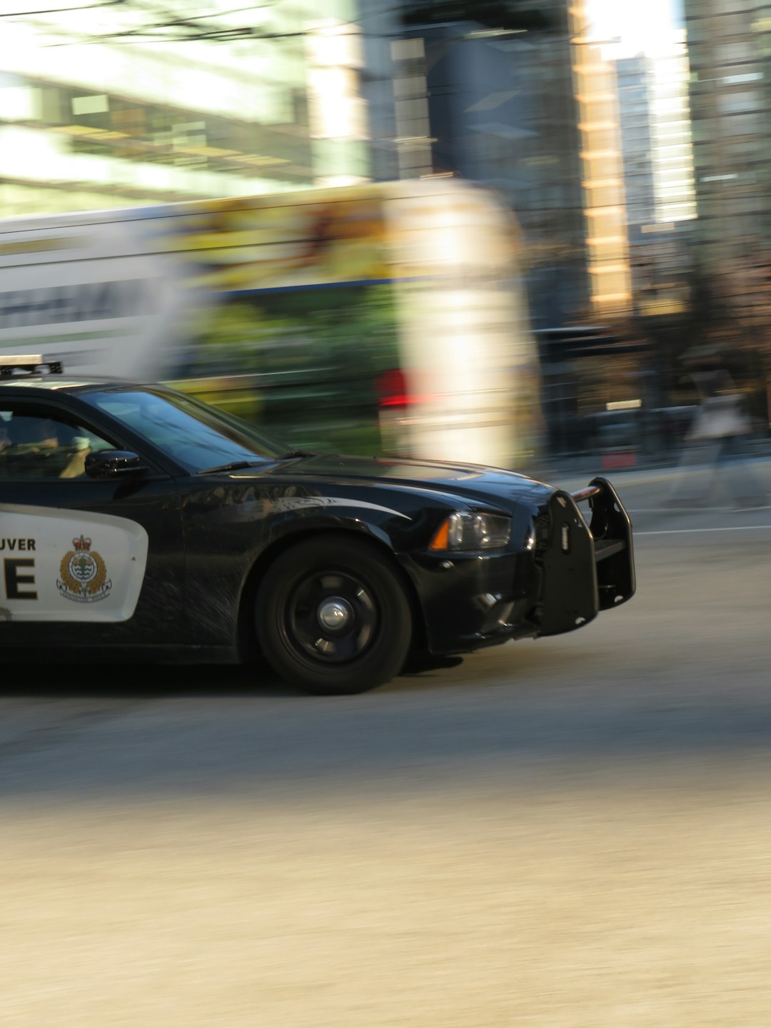 Home Police car drives by.