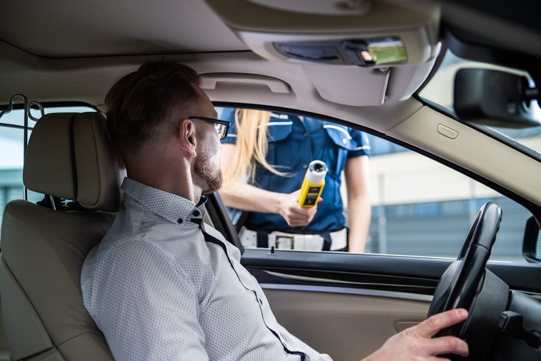 Home a-police-officer-is-performing-a-breathalyzer-test-5a4ssyl2qys